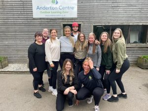 Fresh Perspective team at The Anderton Centre all stood together smiling outside a building.